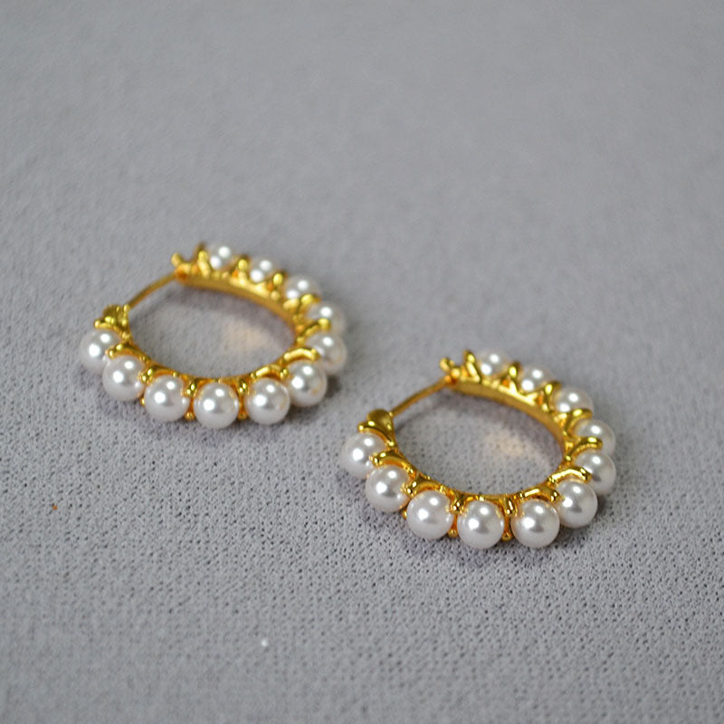 Gold earrings wrapped in pearls