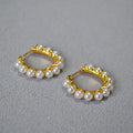 Gold earrings wrapped in pearls