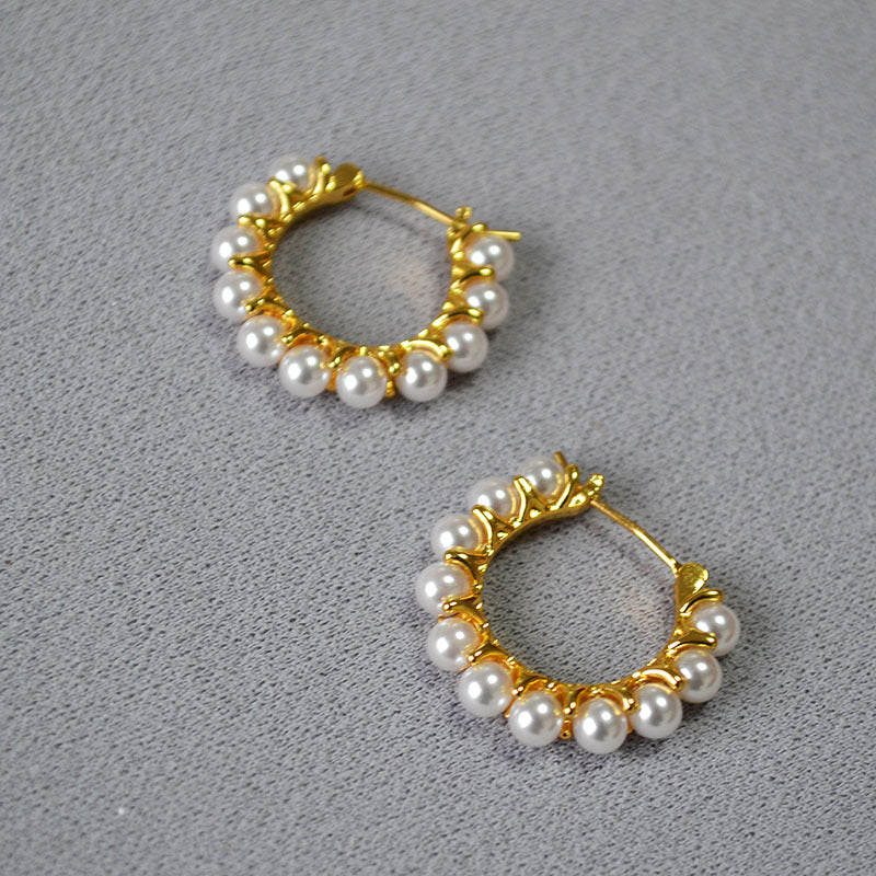Gold earrings wrapped in pearls