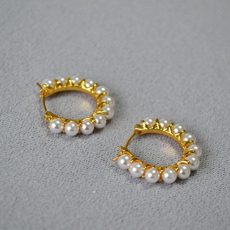 Gold earrings wrapped in pearls