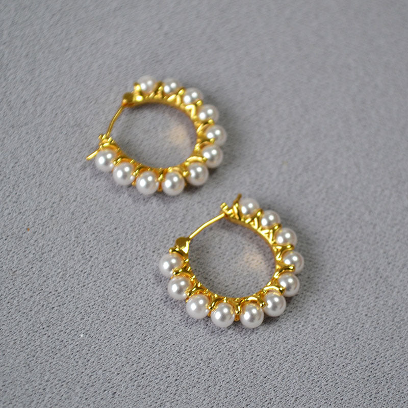 Gold earrings wrapped in pearls