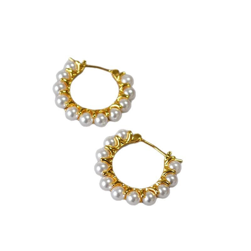 Gold earrings wrapped in pearls