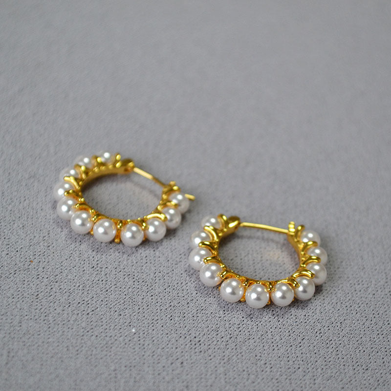 Gold earrings wrapped in pearls